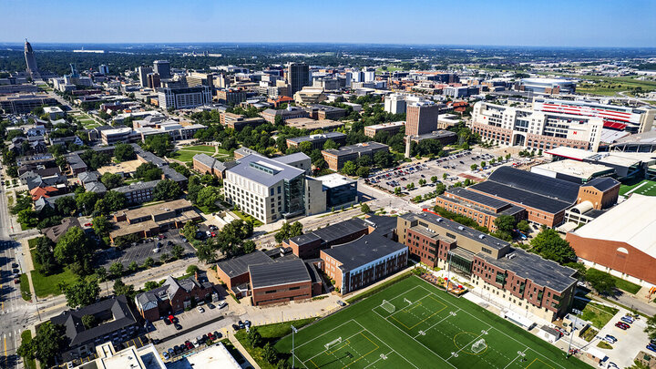 Aerial image of campus from the north including College of Business, campus recreation fields, and other buildings