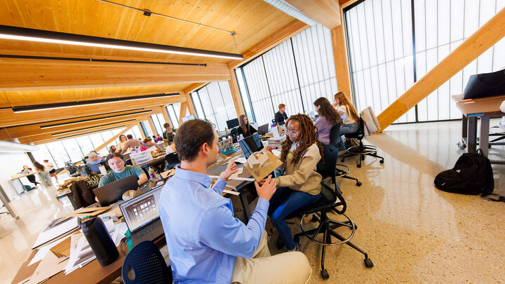 Faculty member talks with student in new Architecture classroom