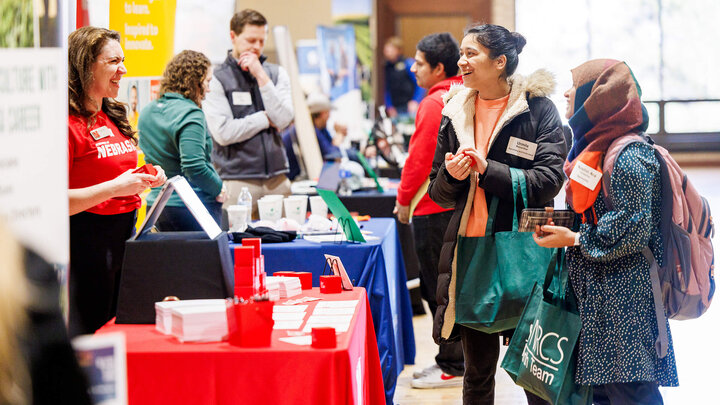Students talk to prospective employers at East Campus career fair