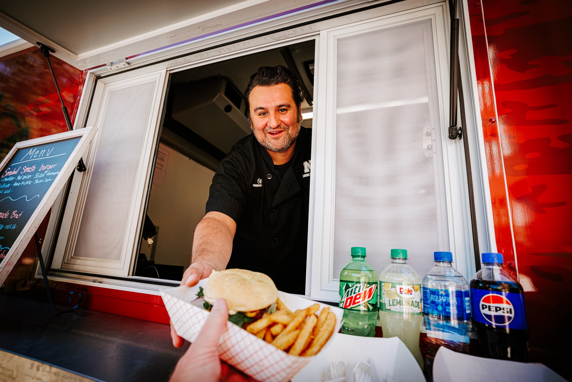 Person selling food from a food truck