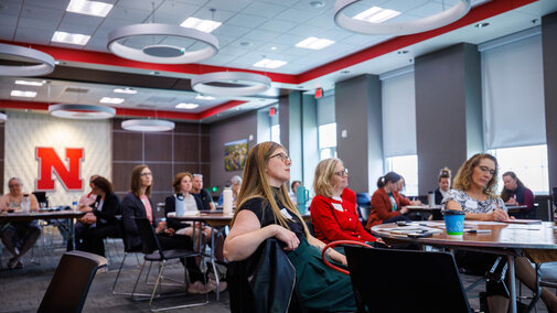 Staff members in training room watching presenter