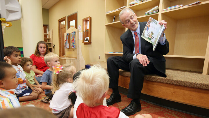 Chancellor Harvey Perlman reads a book to youth at the UNL Children's Center. The UNL Children's Center has earned accreditation from the National Association for the Education of Youth Children.