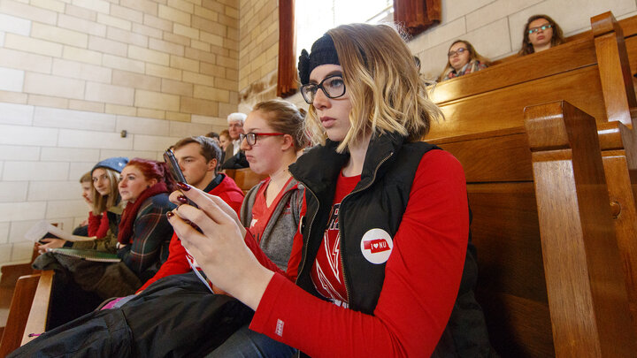 Husker Tia Rasmussen takes a photo of the legislative session while attending the "I Love NU" Advocacy Day at the State Capitol in 2018. The event was attended by several hundred students, staff, faculty, alumni and friends of the NU system.