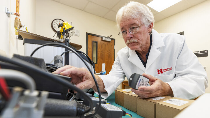 Senior Nebraska Mesonet technician Glen Roebke runs tests on a set of weather station barometers. A new sensor calibration lab has been developed by the Nebraska State Climate Office in Nebraska’s School of Natural Resources.