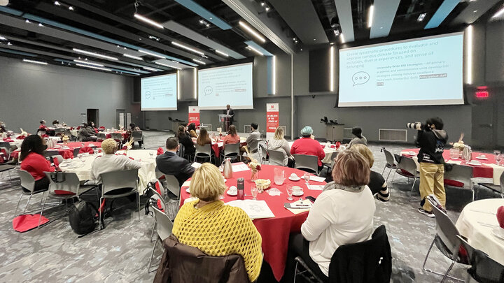 The audience listens while Marco Barker, vice chancellor for diversity and inclusion, presents at the State of Diversity.