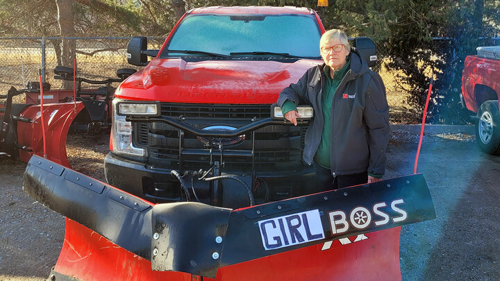 Jolene Meyer stands next to her snowplow on East Campus.