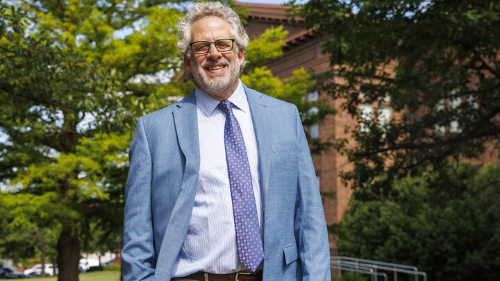 Andy Belser, dean of the Hixson-Lied College of Performing Arts, is photographed outdoors.