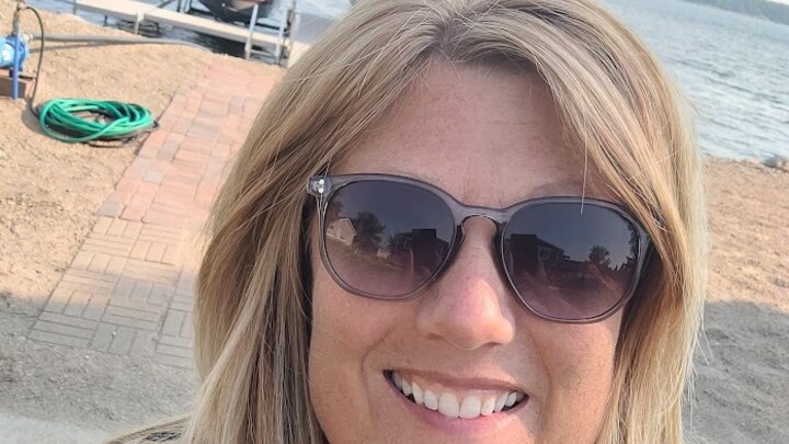 woman on beach with sunglasses