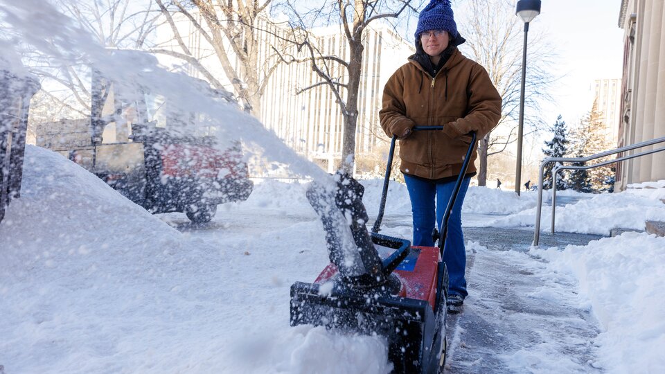 person with snowblower