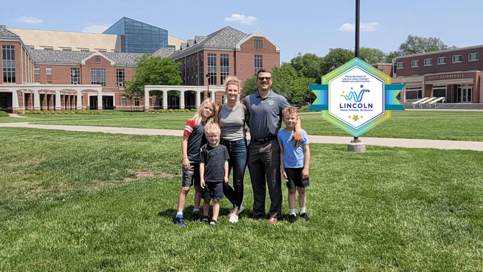 Family of five on university campus