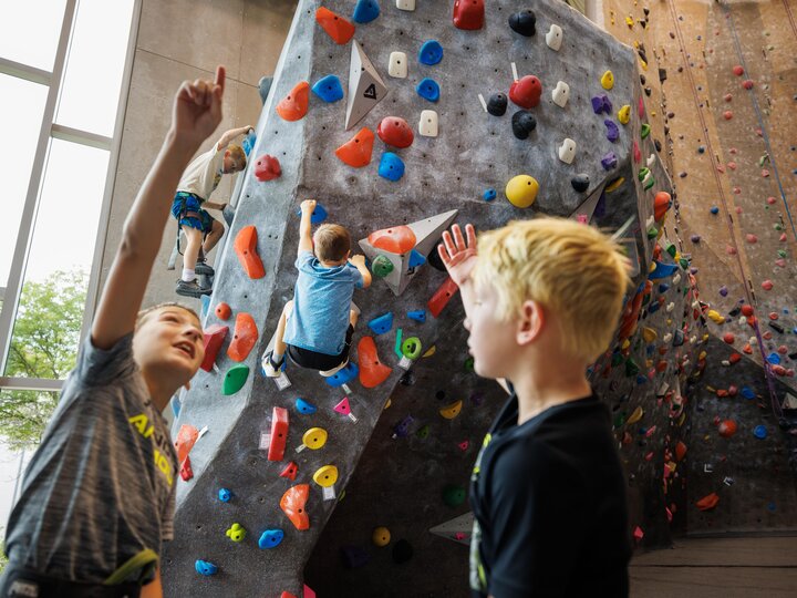 Kids at a rock climbing wall