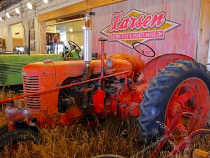 tractor in a building on display