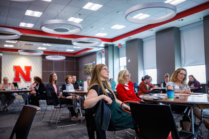 Staff members in training room watching presenter
